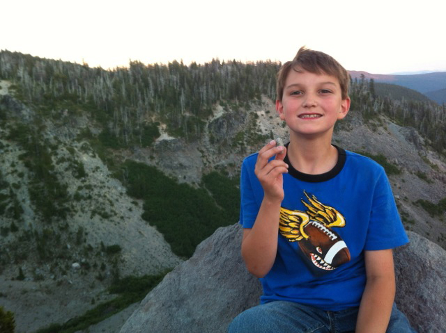 Kim Hancock took a photo of his 10-year-old son, Cole, holding a special rock he found at the top of a hike up a hill on Mount Hood.