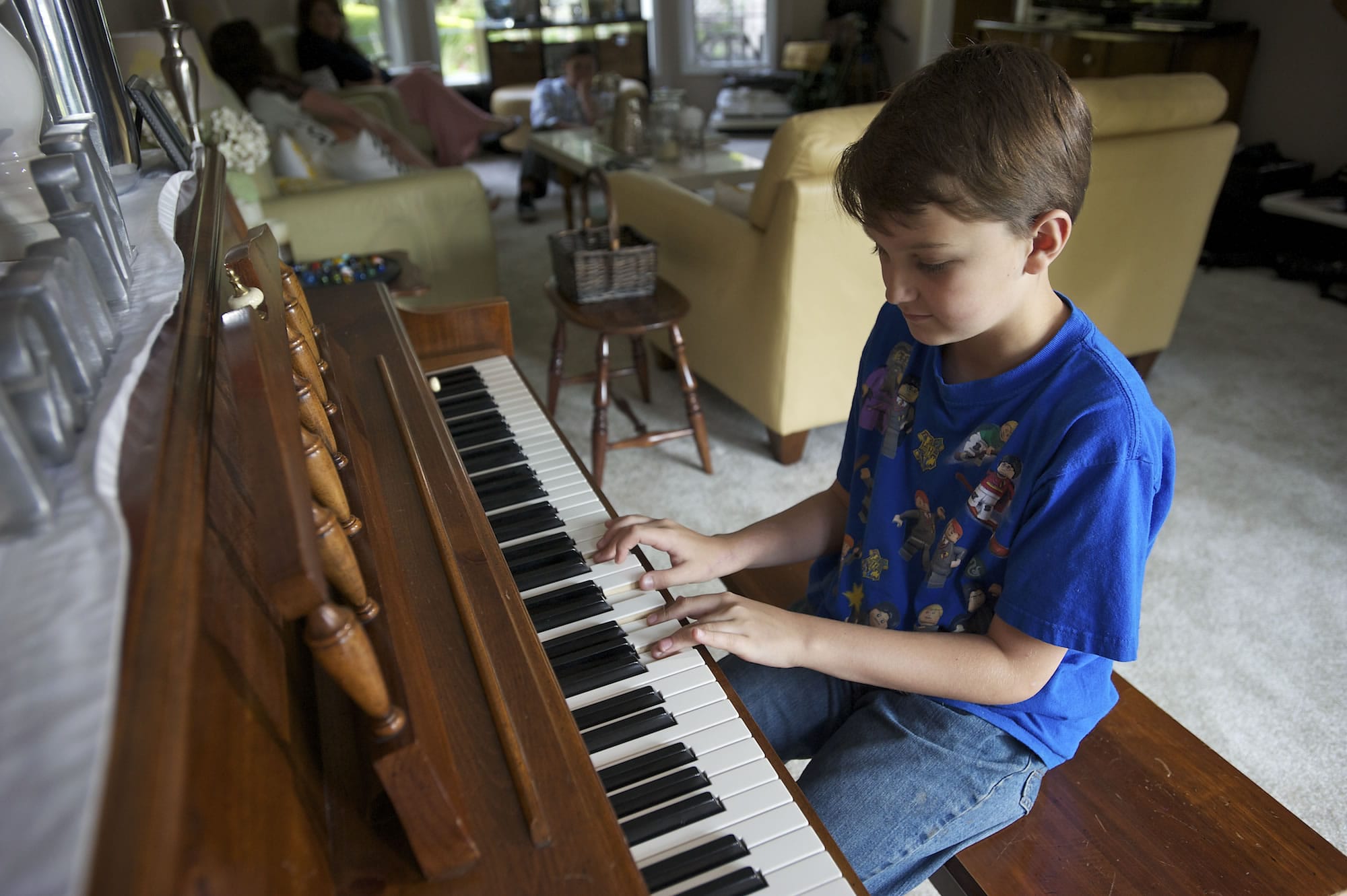 Cole Hancock, 10, still has trouble saying and remembering some words, but he remembers the piano pieces that he's learned.