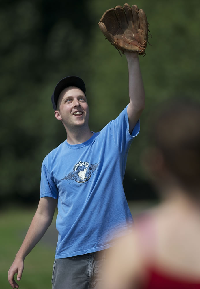 Vancouver's Ryan Amrine, 24, plays catch Sunday with girlfriend Jenni Freeman, 23, of Vancouver at Frenchman's Bar.