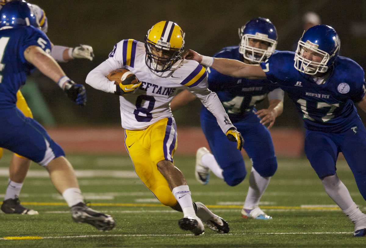 Columbia River's Terrell Bolton, #8, carries the ball against Mountain View on Friday.