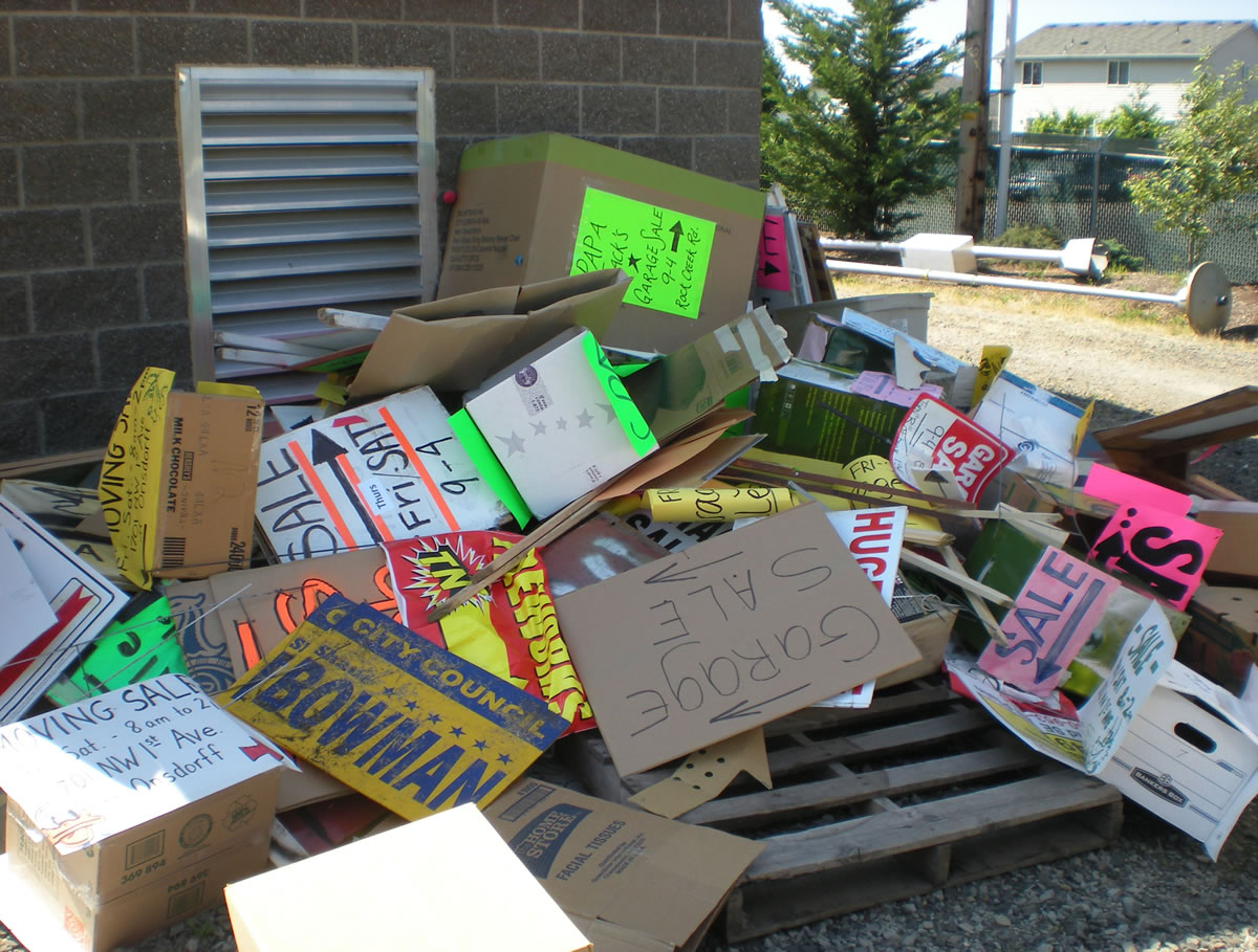 Signs pile up outside after a sweep of placards placed illegally in the public right-of-way.