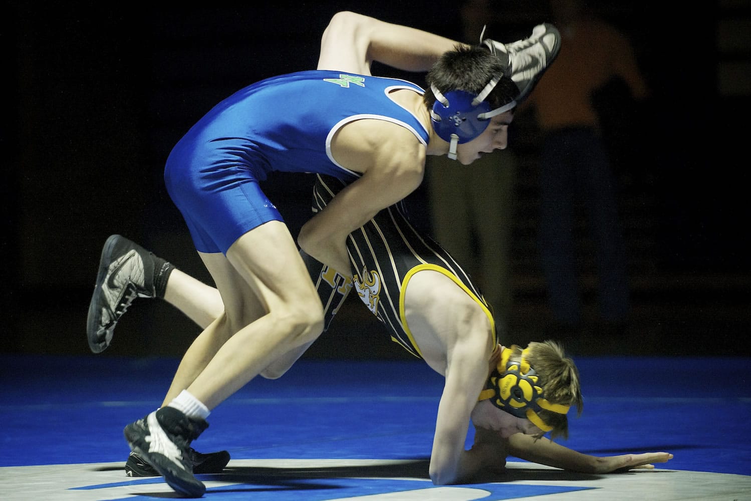 Ben Dixon of Mountain View High School takes down Tyler Hovis of Hudson's Bay during the 113 pound match Wednesday January 9, 2012 in Vancouver, Washington. Dixon pinned Hovis later in the match.