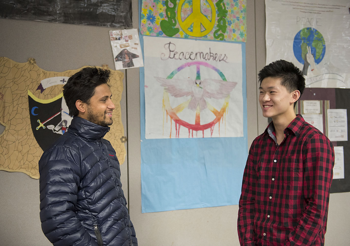 Navraj LamiChhane of Nepal, left, chats with Skyview High School senior Richard Lu on Tuesday in Beverly Questad's classroom. LamiChhane and Lu, who met face-to-face for the first time Tuesday, had worked together to get tents to Nepalese refugees left homeless by the April 25 earthquake. LamiChhane arrived from Nepal on Monday on a five-year student visa. He begins classes at Washington State University Vancouver in January.