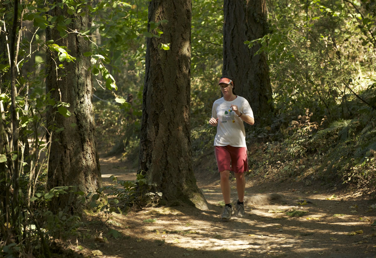 Elisabeth Massie jogs around Round Lake in Camas on Thursday.