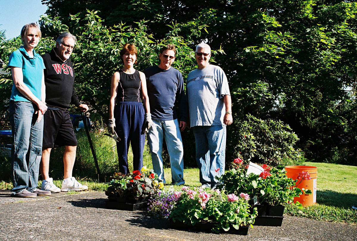 Mount Vista: Marianne Beck, from left, Michael Bayautet, Fran Richter, Doug Richter and Rick Stellfox helped out with a neighbor's property July 7.