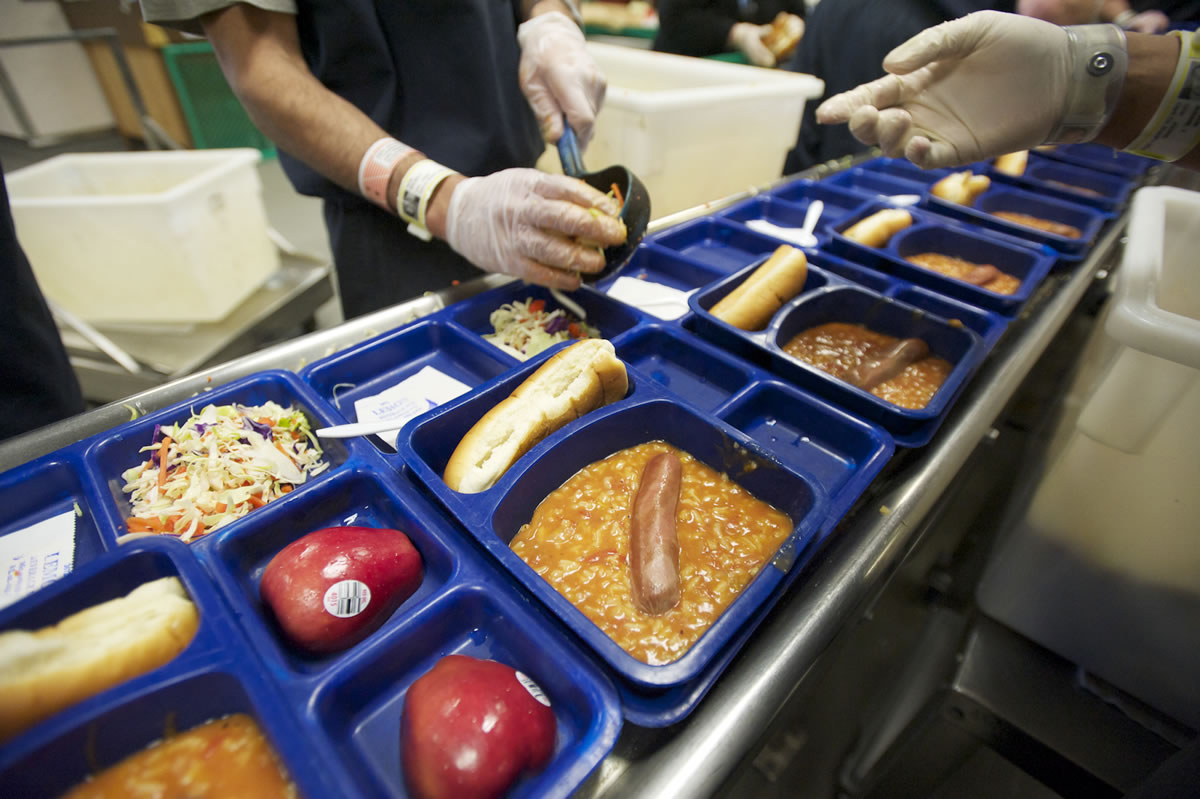 Inmates prepare a typical, non-specialized lunch at the Clark County Jail Work Center earlier this month.