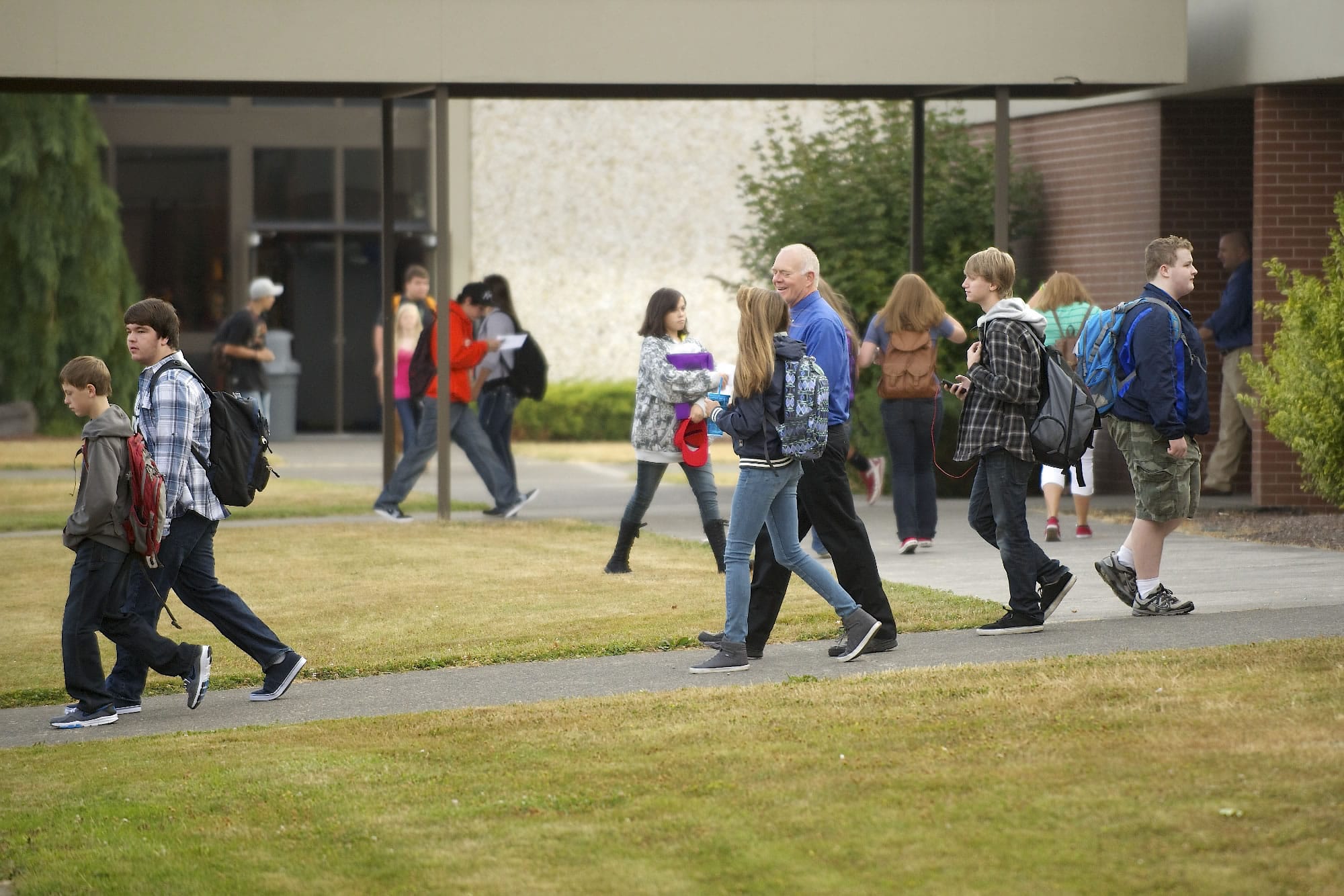 Students and staff make their way to class during the first day of school Wednesday at Ridgefield High School.