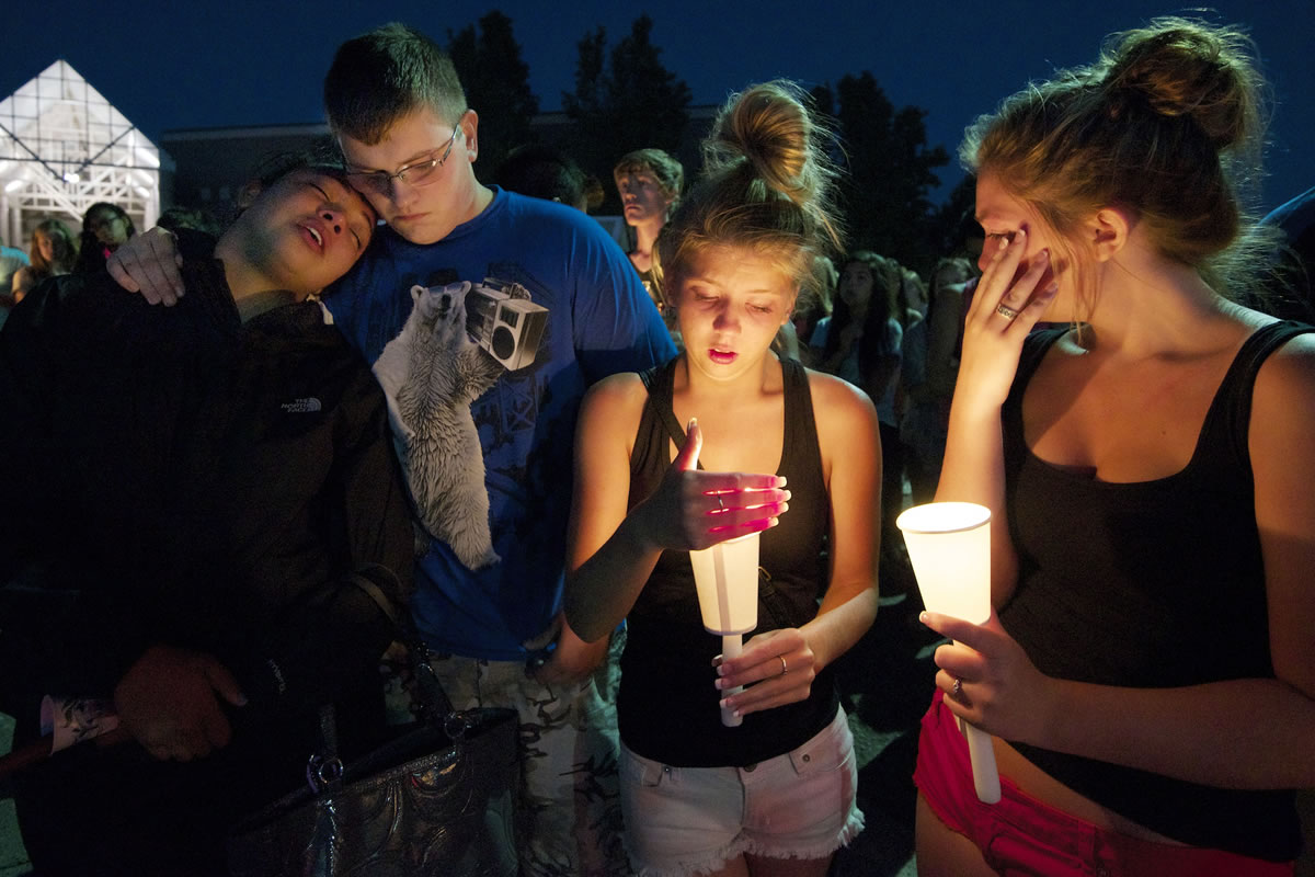 Skyview High School students, from left, Jataya Sewell, 17, Joel Carter, 17, Caitie Welch, 17 and Sara Campbell, 16, take part in a Tuesday evening candlelight vigil in memory of fellow student Kaitlin Miller.
