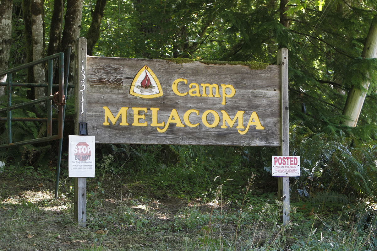 A simple wooden sign marks the entrance to the newly purchased Camp Melacoma, a former Camp Fire youth camp that was closed in 2010 after arsenic was discovered in the drinking water of one of three wells.
