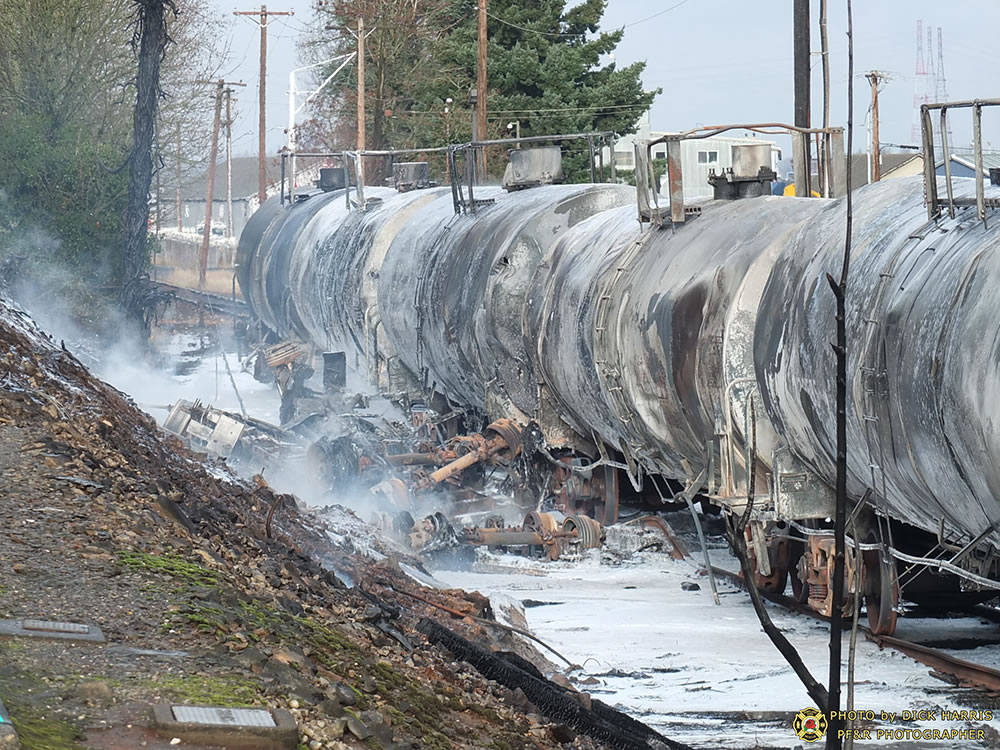 Crews respond to a fire caused by a fatal crash between a tractor-trailer and a train Sunday morning in Northwest Portland.