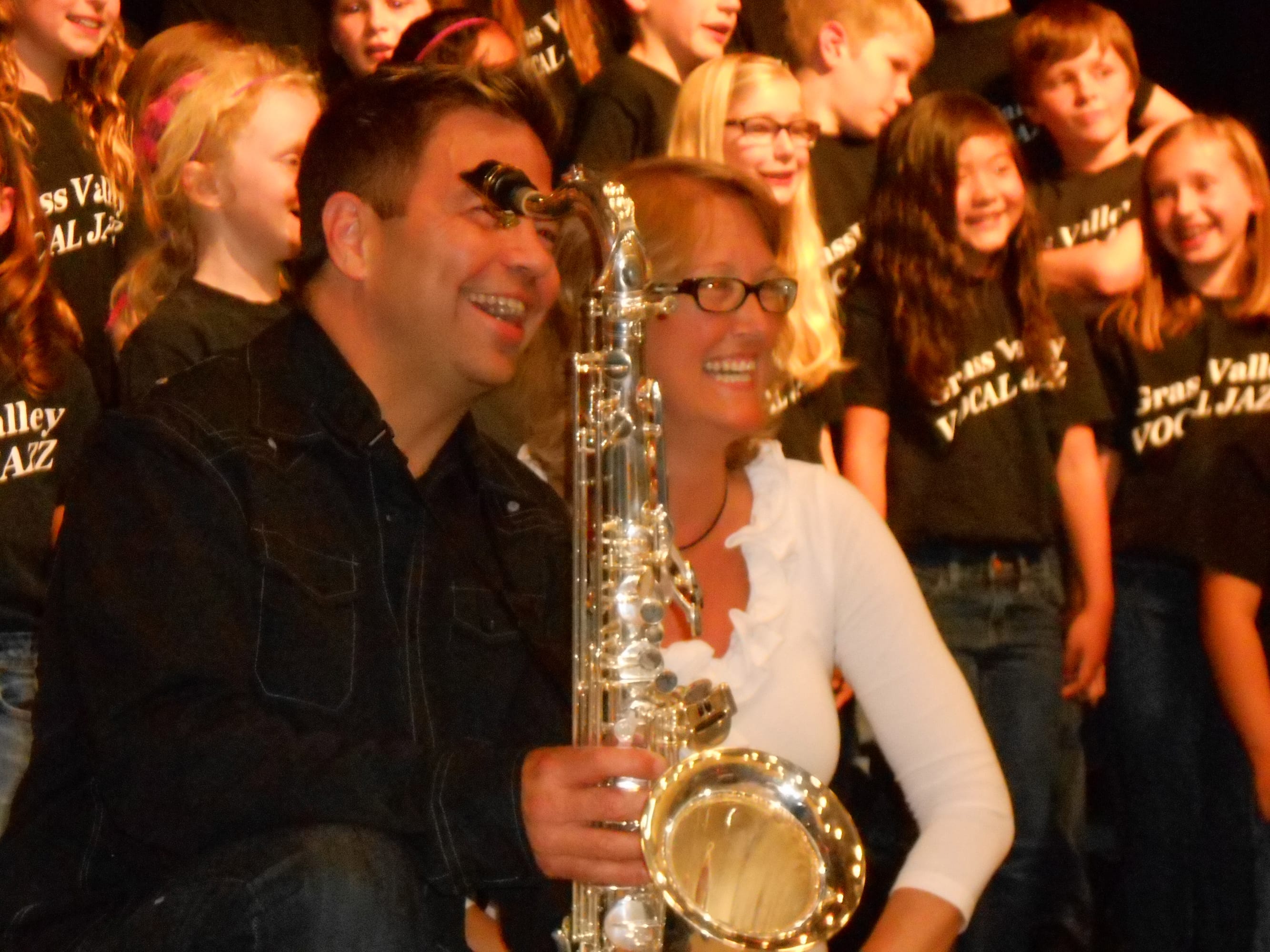 Camas: Jazz saxophonist Patrick Lamb and Grass Valley Elementary School music teacher Natalie Wilson smile at the audience at Lamb's May 28 performance with the school's vocal jazz group.