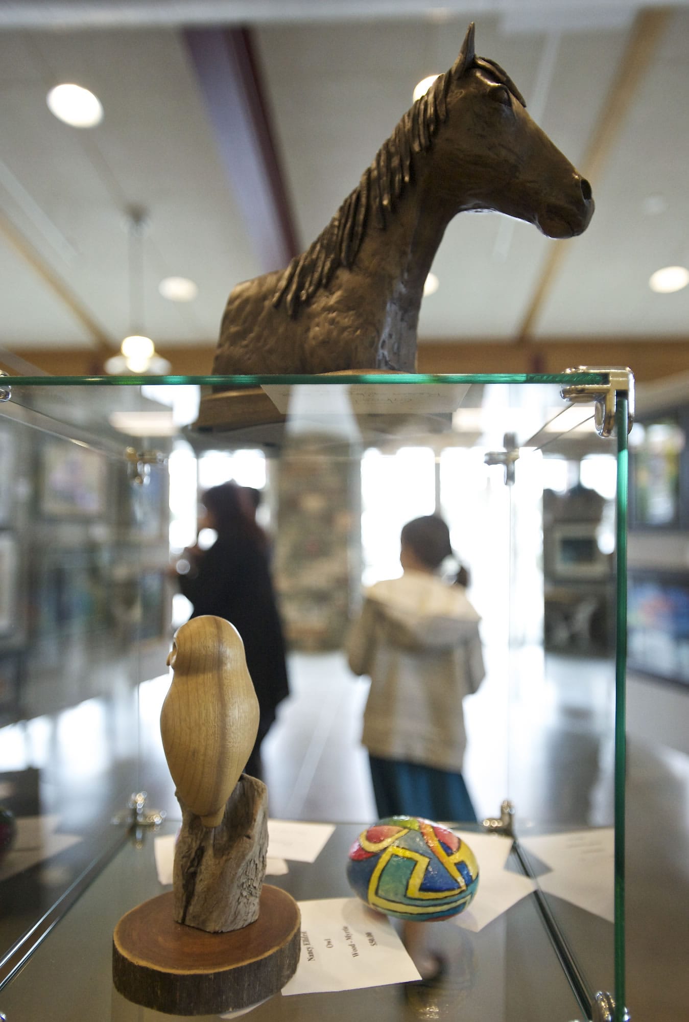 &quot;Ghost,&quot; made from resin with bronze flake by Cyndi Rivers, sits atop a glass case at the Battle Ground Art Alliance's annual show.