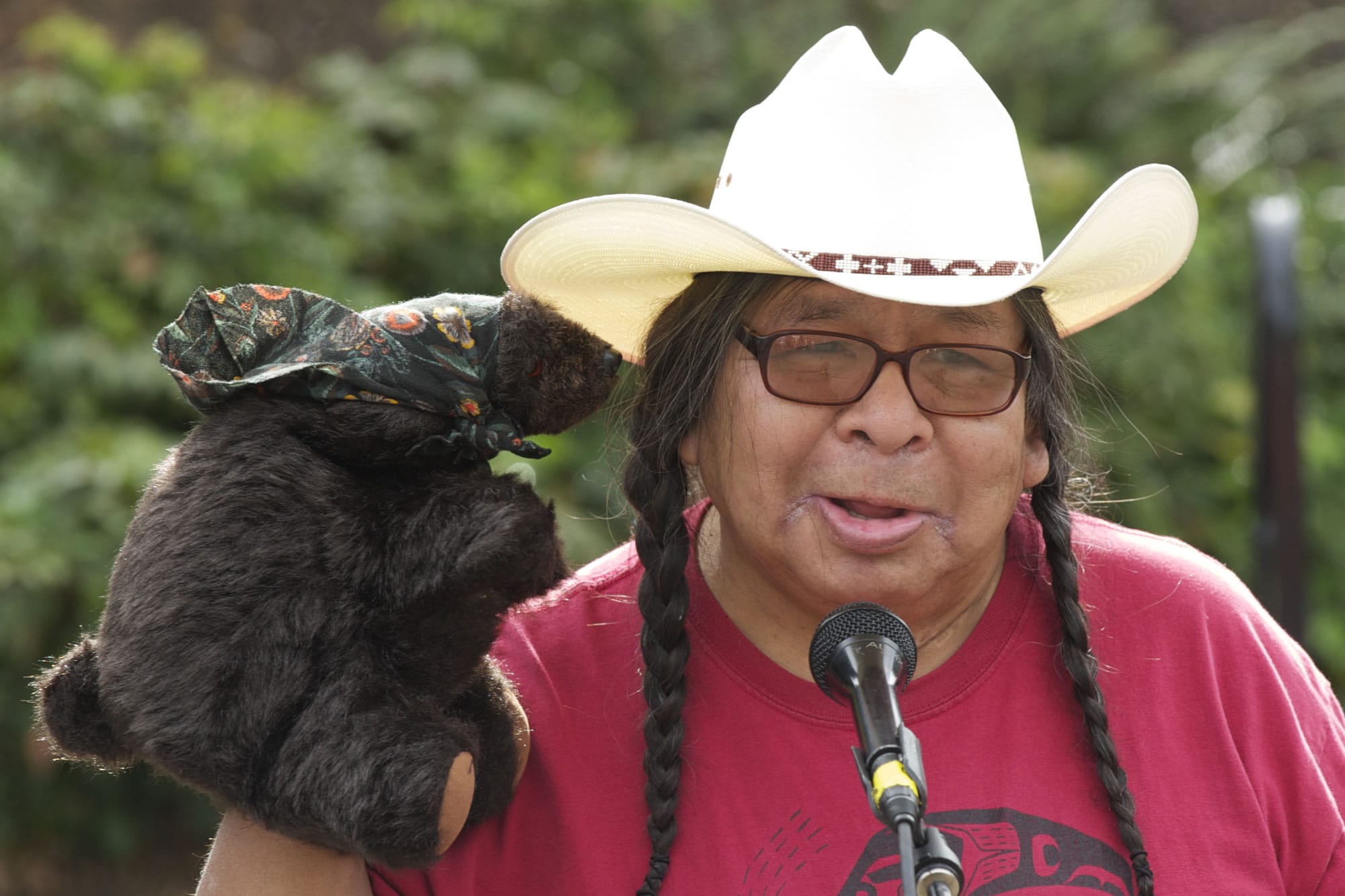 With help from his Grandmother Bear puppet, traditional storyteller Ed Edmo entertains and educates the crowd with American Indian legends at the Vancouver Land Bridge fifth anniversary celebration on Saturday morning.