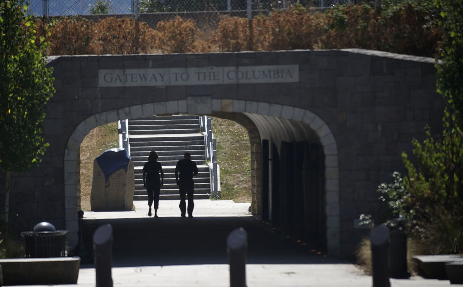 A man and woman walk through the pedestrian tunnel beneath state Highway 14, which connects downtown Washougal with the waterfront.
