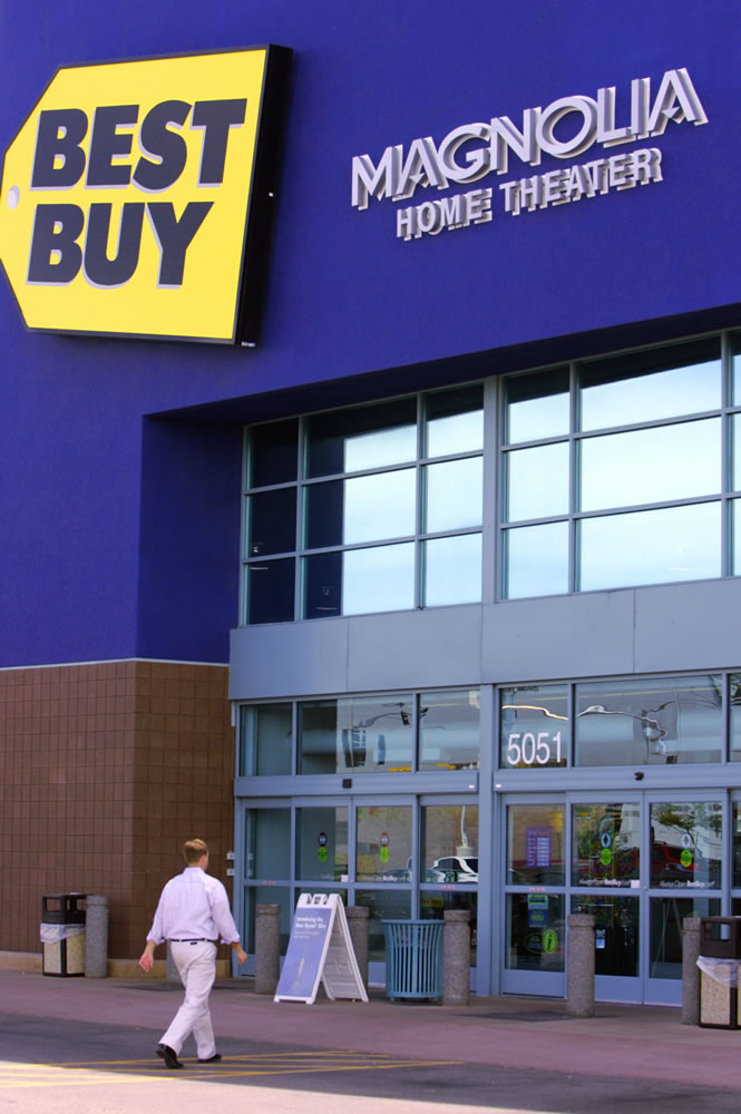 A customer heads for the entrance of the Ahwatukee Best Buy retail store, Wednesday, April 4, 2007, in Phoenix, Ariz.  The largest consumer electronics retailer in the U.S., Best Buy Co., Inc., reported fourth quarter profits were up 18 percent.  (AP Photo/Ross D.