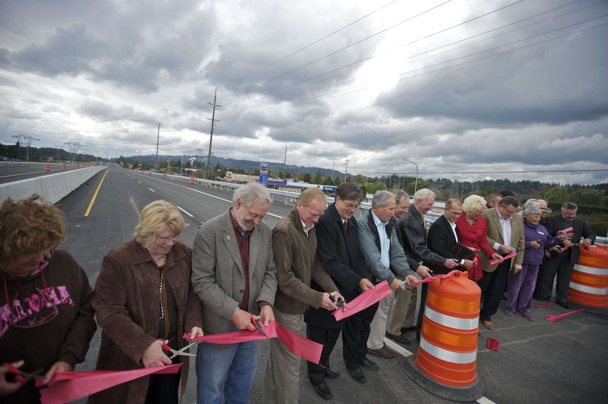 Dignitaries line up as the Washington State Department of Transportation has a ribbon cutting for a stretch of Highway 14 through Camas and Washougal in October.
