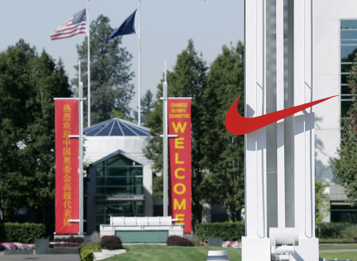 The red Nike swoosh marks the entrance to the company's headquarters campus in Beaverton, Ore.