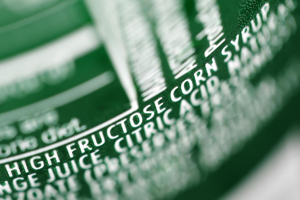 High fructose corn syrup is listed as an ingredient on a can of soda.