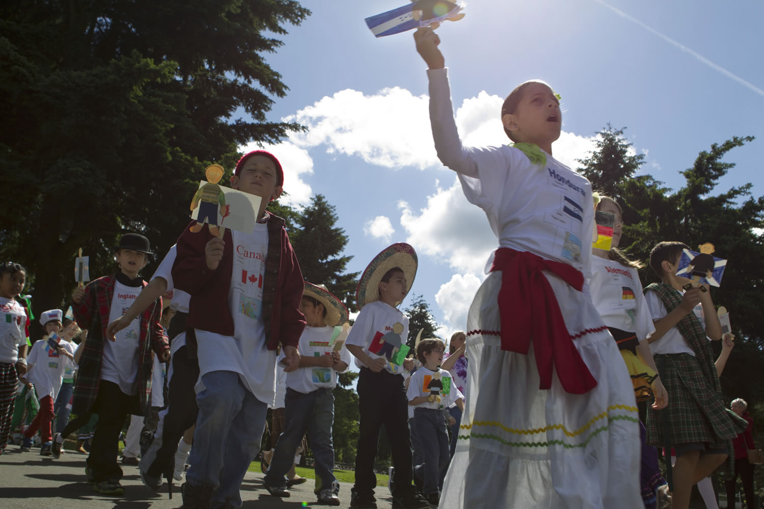 Wearing costumes and carrying flags and dioramas, third-grade students from the Vancouver and Evergreen school districts celebrate their heritage Friday in the annual Children's Cultural Parade at Fort Vancouver.