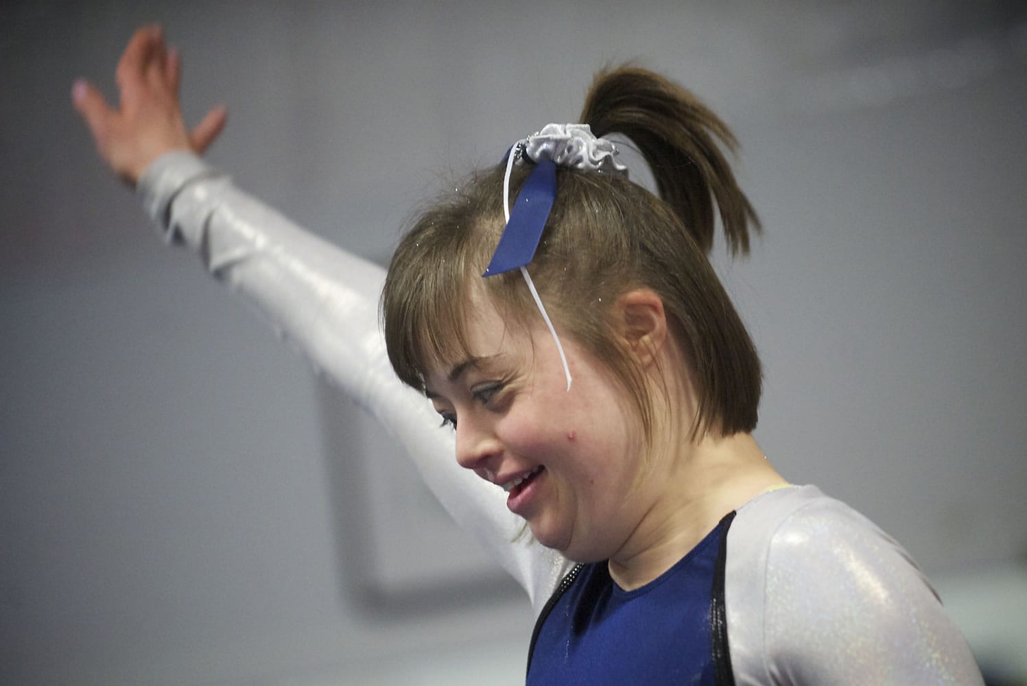 Geneva &quot;Gigi&quot; Gernhart, 24, focuses on her balance beam routine Sunday as her Special Abilities team competes in an open meet with five local clubs at Naydenov Gymnastics.