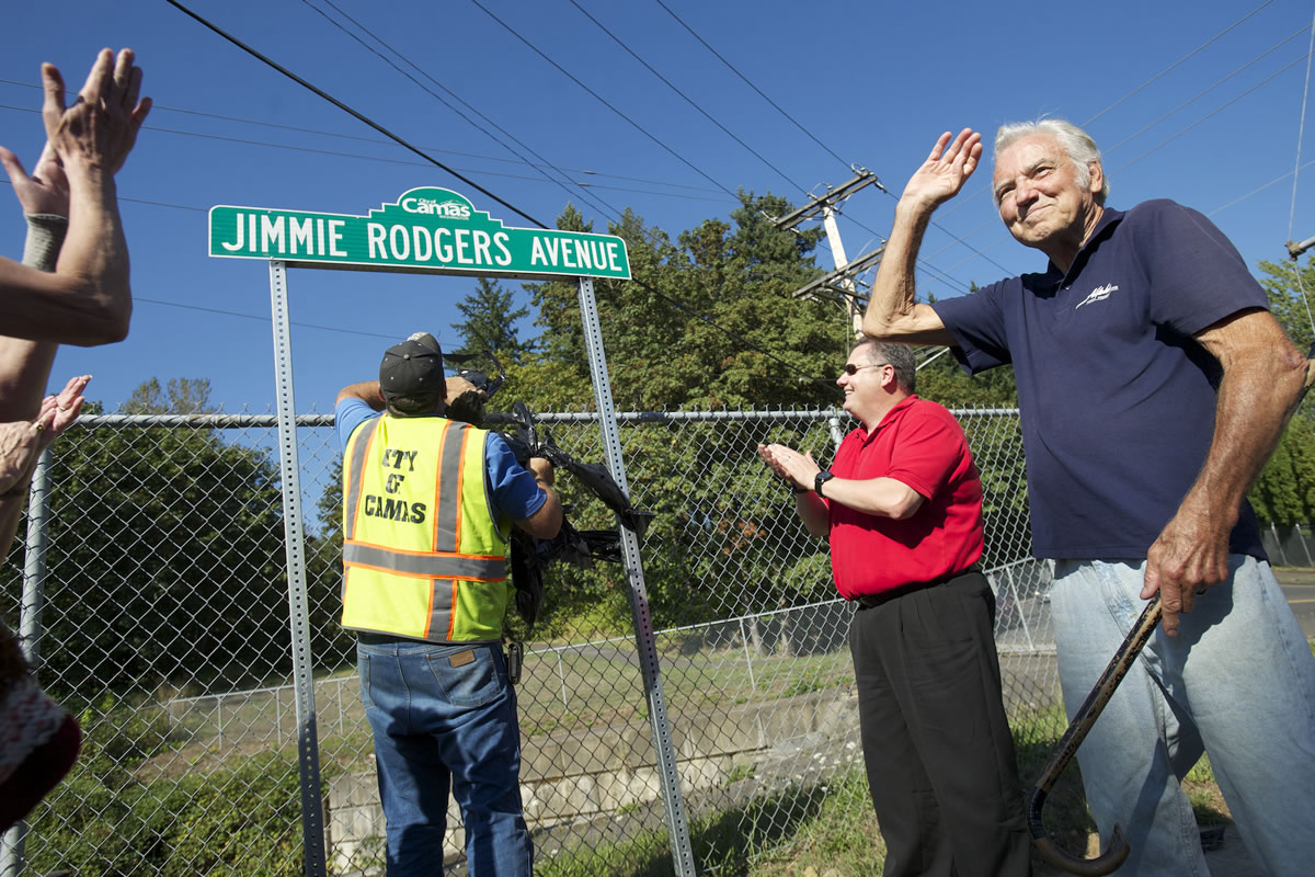 Pop singer and Camas native Jimmie Rodgers waves to the crowd during a street sign dedication ceremony Friday.