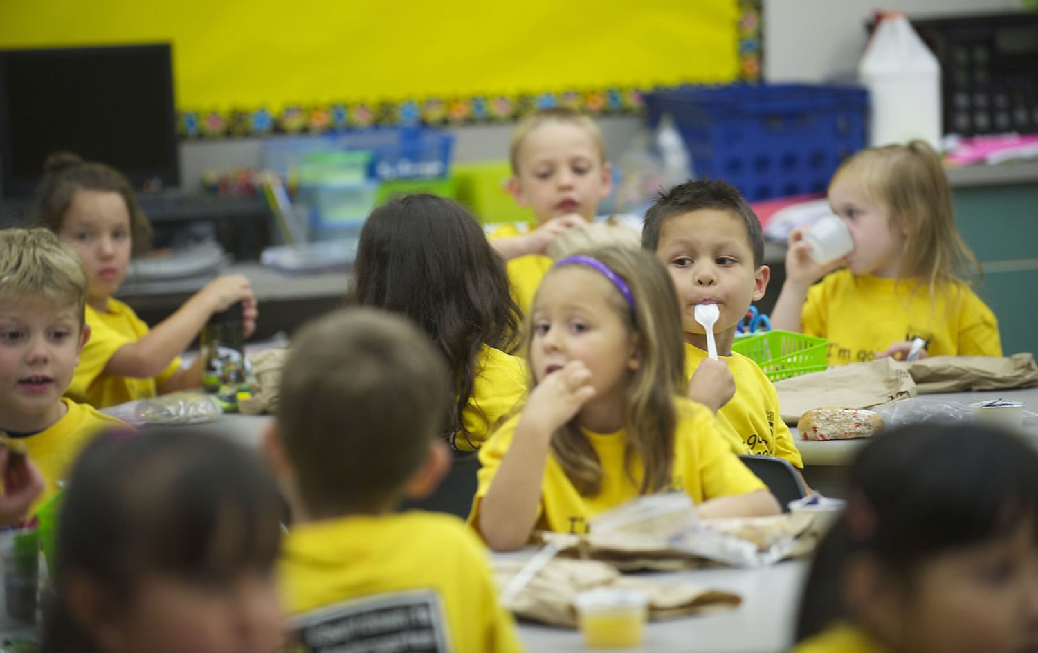 Renee Sutter's kindergarten class enjoys snack time at Harney Elementary School during Jump Start Kindergarten.