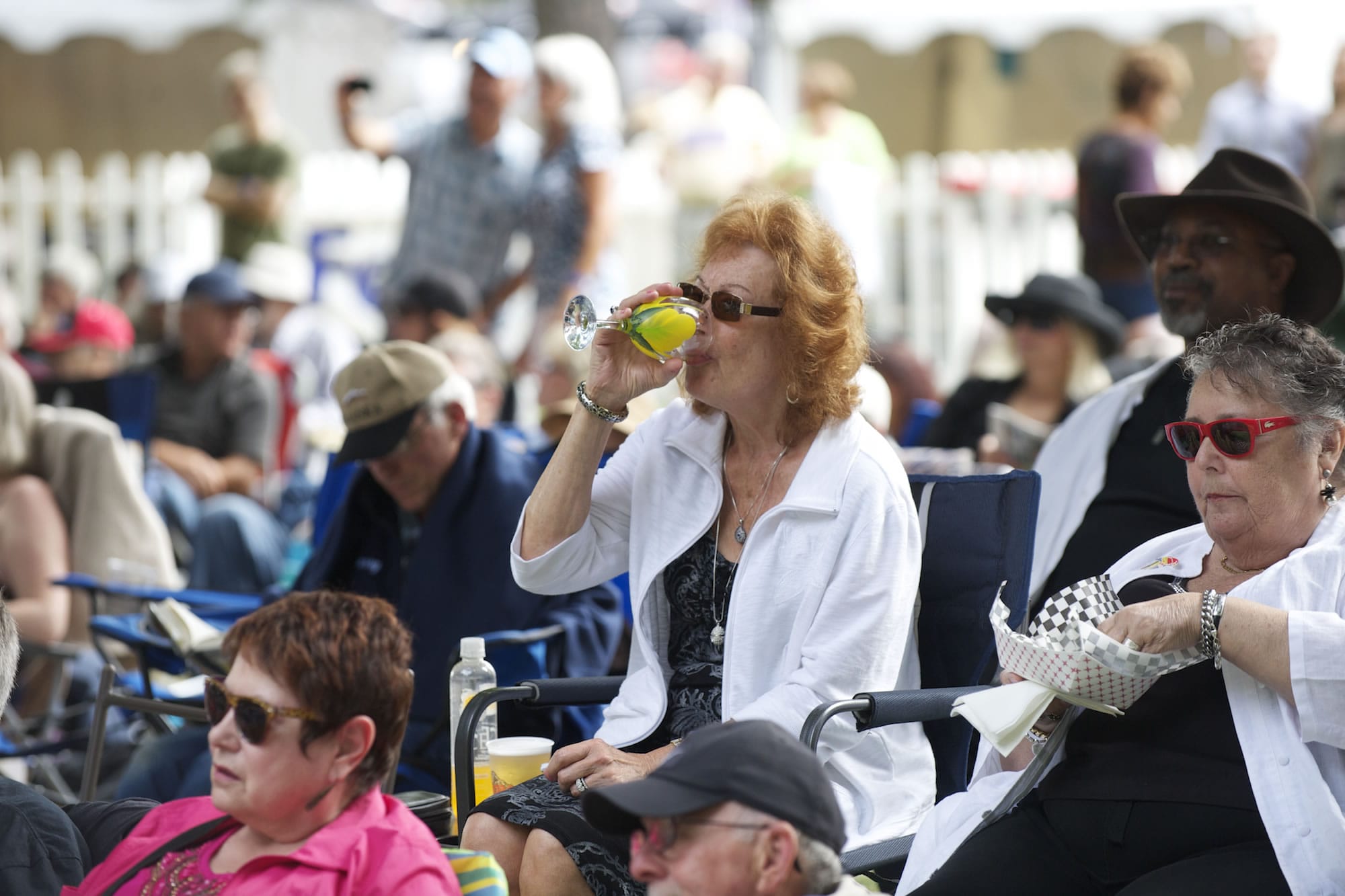 Gail Pritchett enjoys a drink Sunday at the 2013 Vancouver Wine and Jazz Festival in Esther Short Park.