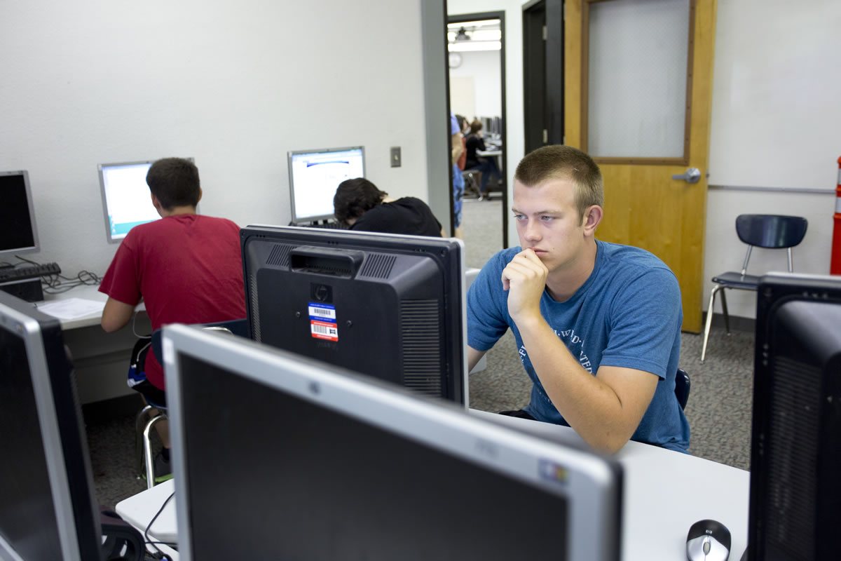 Alex Peterson, 16, a senior at Columbia River High School, works on the PLATO computer credit recovery program in summer school in an attempt to make up credits after failing classes as a Running Start student at Clark College.