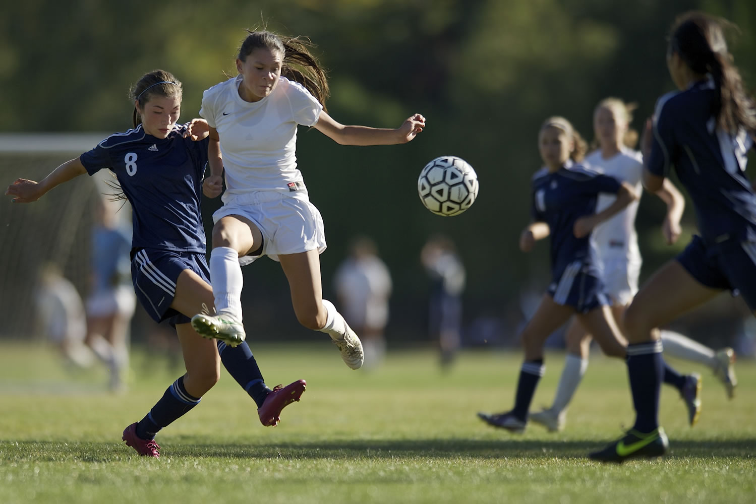 Taylor Halquist, 8, right, of Columbia River High School fights for control of the soccer ball against Maya Nicol, 8, of Hockinson High School in a game Tuesday September 4, 2012 in Vancouver, Washington.