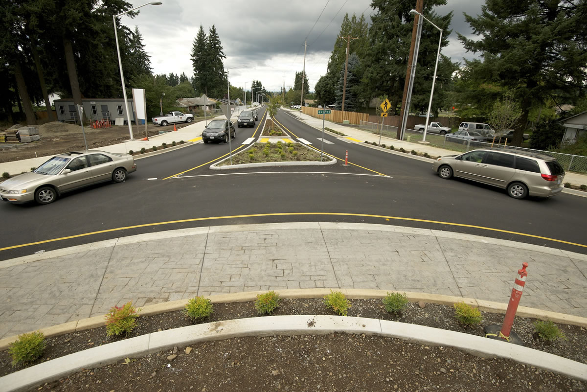 Motorists navigate their way around a new roundabout on Sept.