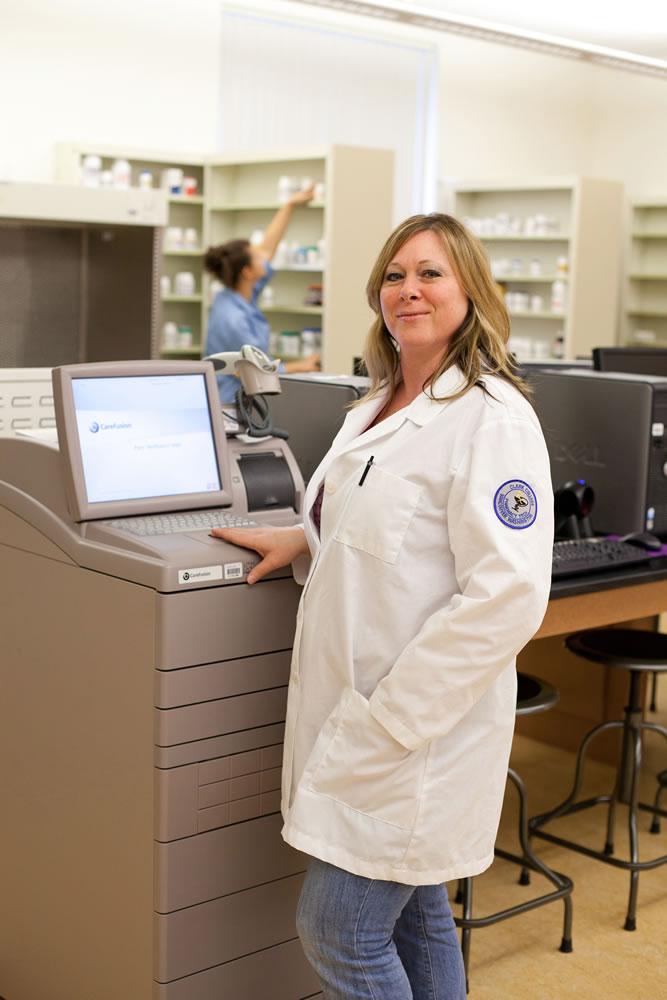 Clark College pharmacy student Candy Pfannes gets hands-on training at Clark's new simulation pharmacy at the Washington State University Vancouver campus.