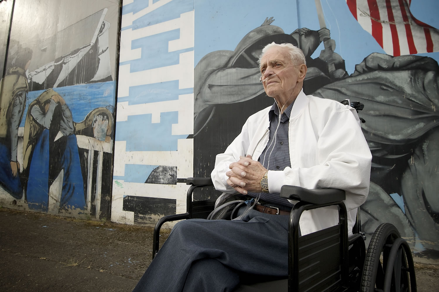 Hal Berven recalls being aboard the Vancouver-built USS Gambier Bay when it was sunk during the Battle of Leyte Gulf in 1944. The mural at the left shows the sinking of the USS St. Lo (which was launched on Aug.