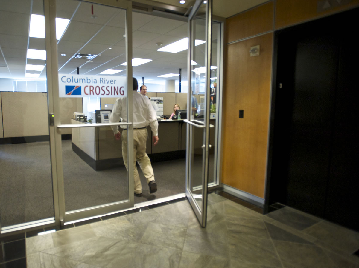 A man enters the Columbia River Crossing offices in Vancouver as the project continues shutting down Friday.