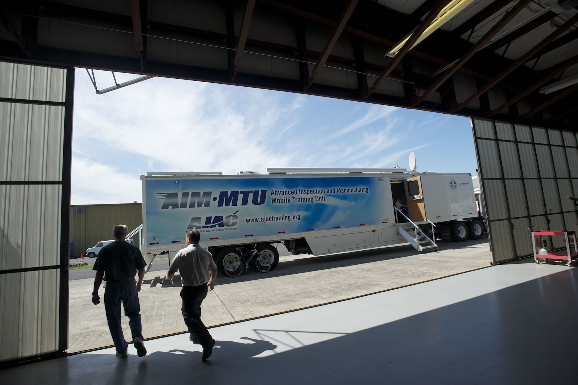 A mobile classroom owned by the Aerospace Joint Apprenticeship Committee sits outside a hangar at Pearson Field last week.