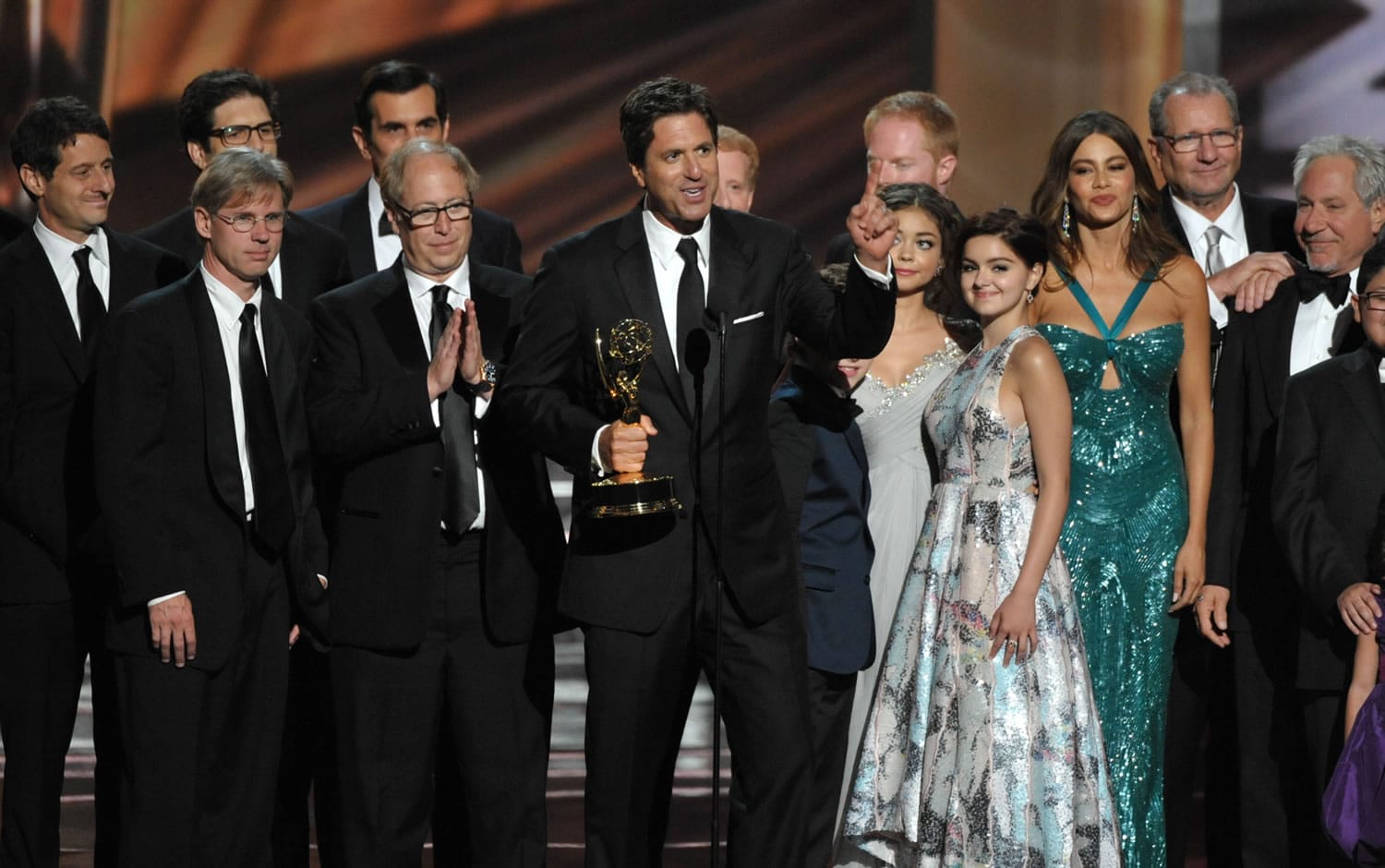 Steven Levitan, center, and the cast and crew of &quot;Modern Family&quot; accept the outstanding comedy series award at the 64th Primetime Emmy Awards at the Nokia Theatre on Sunday, Sept. 23, 2012, in Los Angeles.