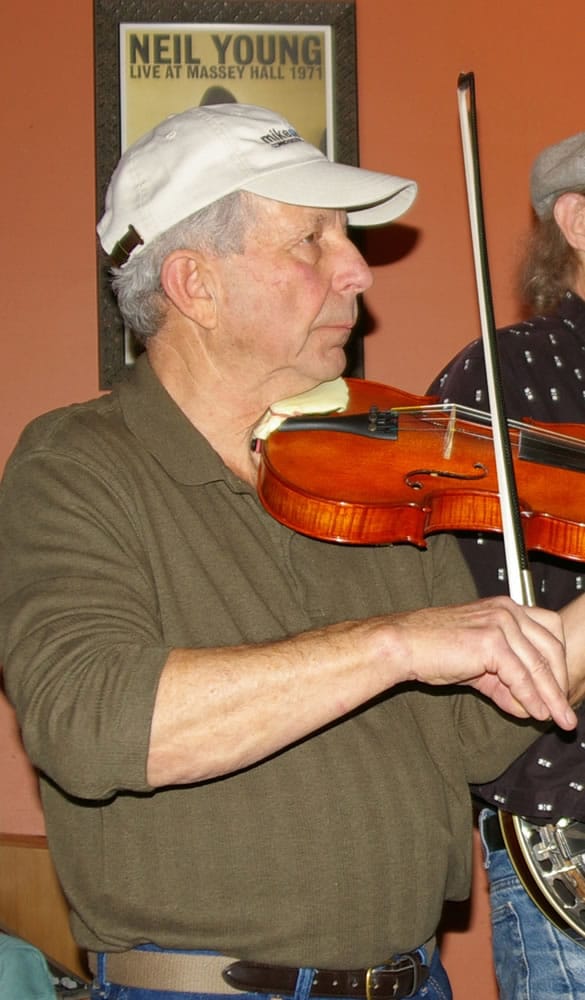 John Melnichuck plays fiddle.