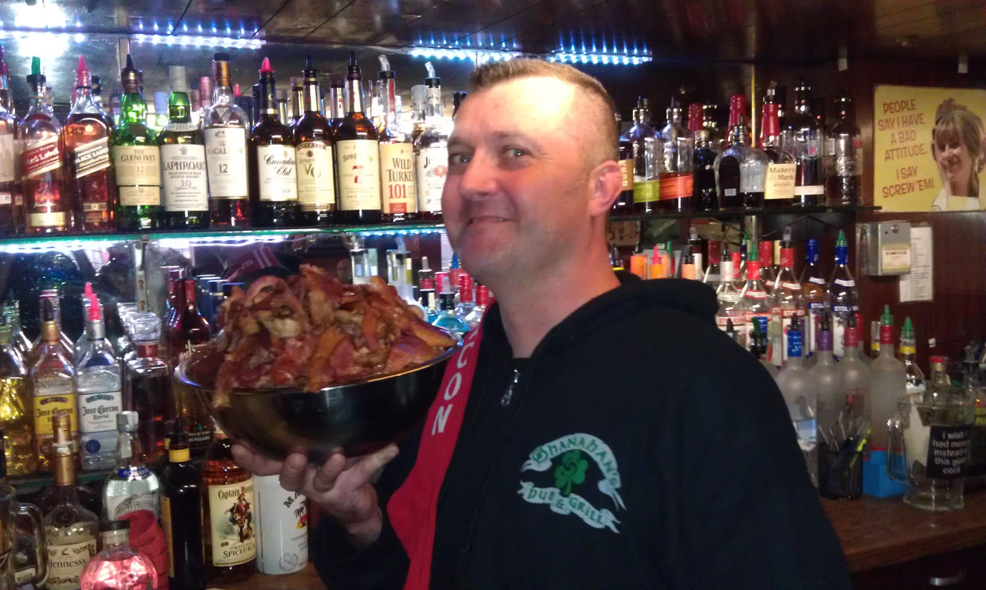 Dave Cookson, owner of Shanahan's Pub &amp; Grill, holds a bowl of bacon.