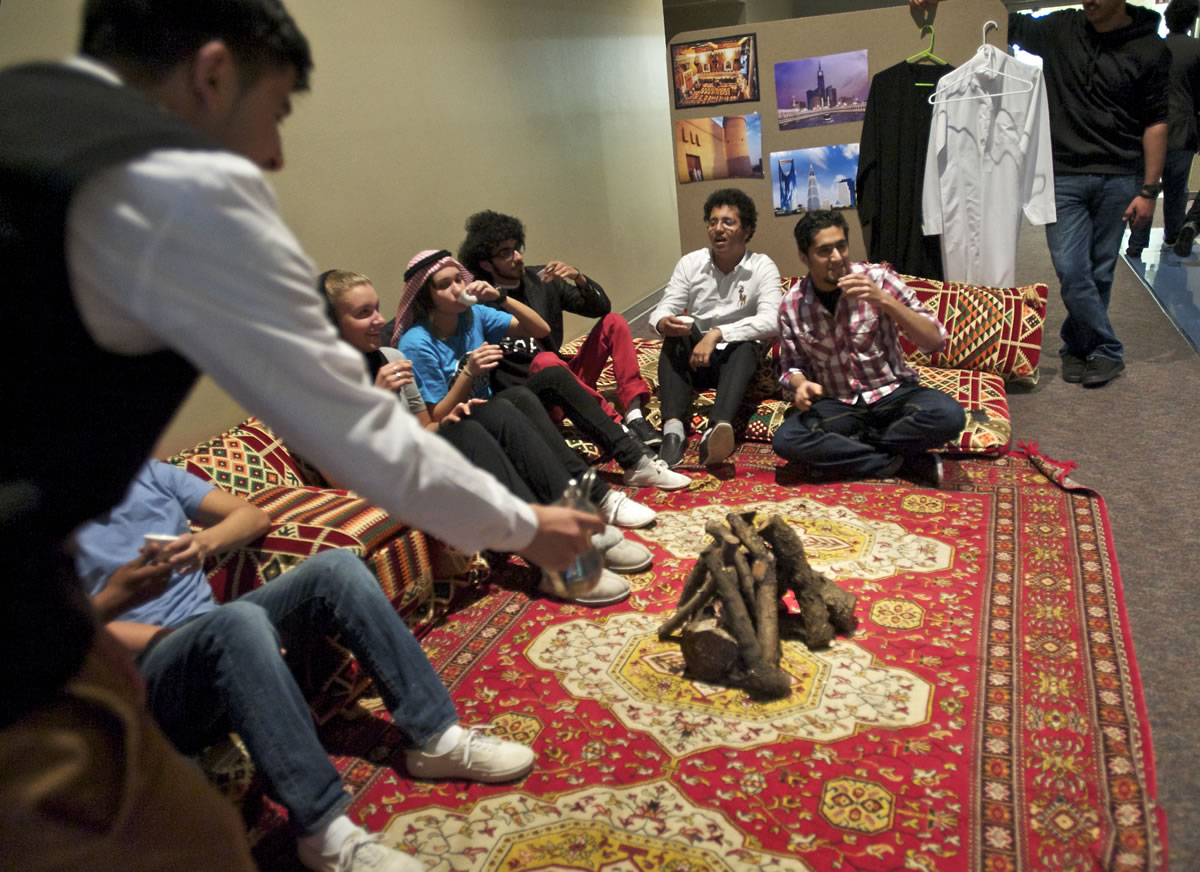 Clark College students sit on traditional cushions as members of the Saudi Student Club offered a glimpse of Saudi culture on Tuesday.