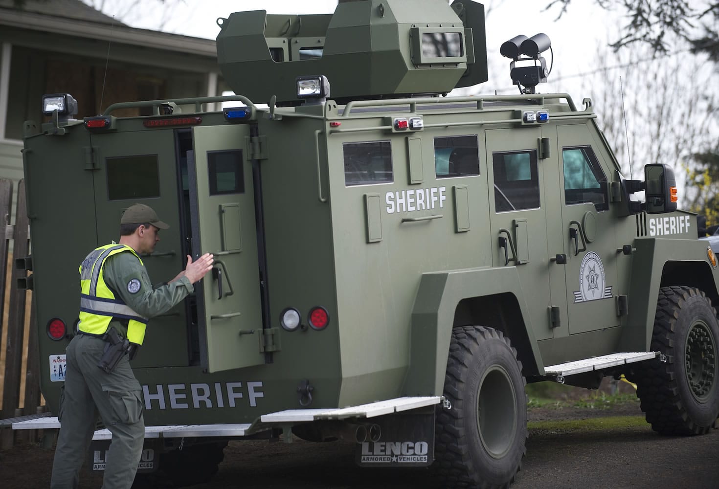 Clark County Sheriff's Cmdr. Tim Bieber shuts the rear doors of a Bearcat, an armored vehicle.