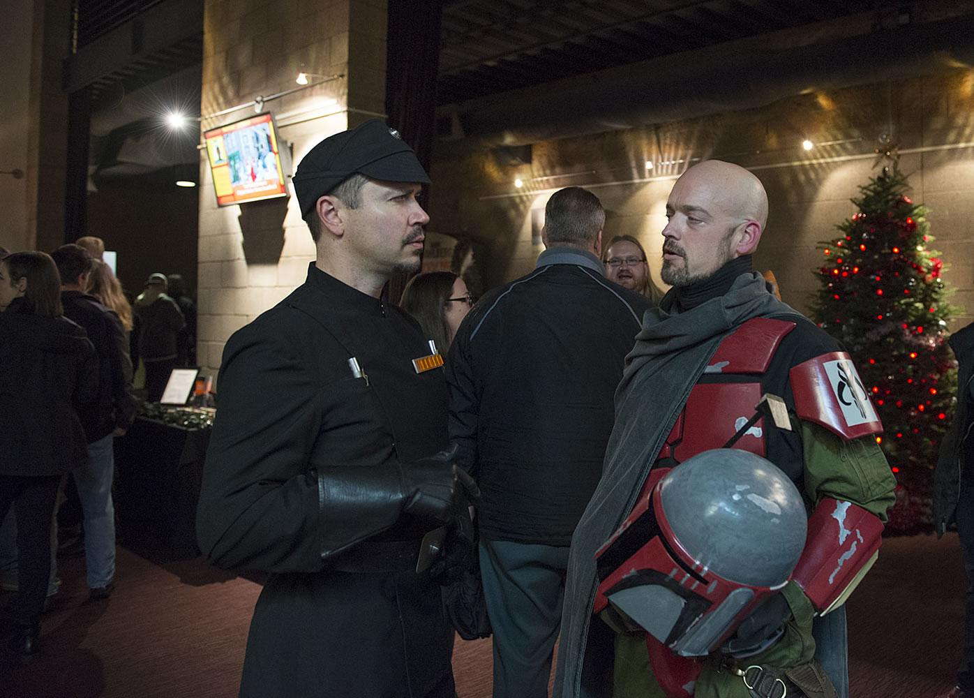 Will Morgan of Vancouver, left, dressed as an Imperial officer, talks with Portland resident Kevin Naish, dressed as a bounty hunter, while joining the crowd at the premiere of the new &quot;Star Wars&quot; movie Thursday night at Cinetopia in Southeast Vancouver.