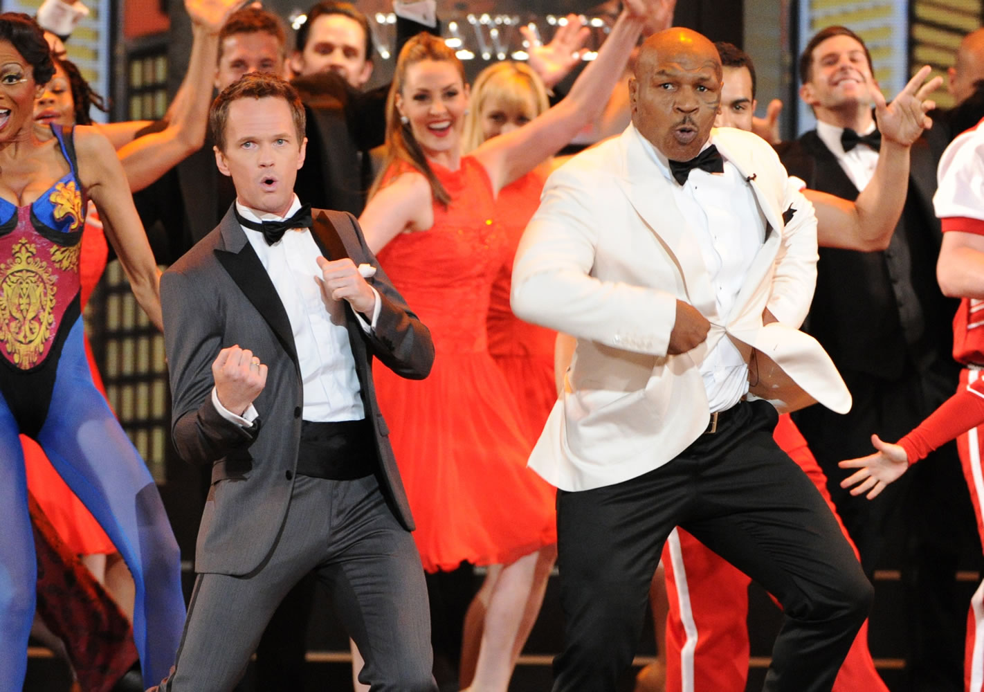 Actor Neil Patrick Harris, left, and Mike Tyson perform Sunday at the 67th Annual Tony Awards in New York.