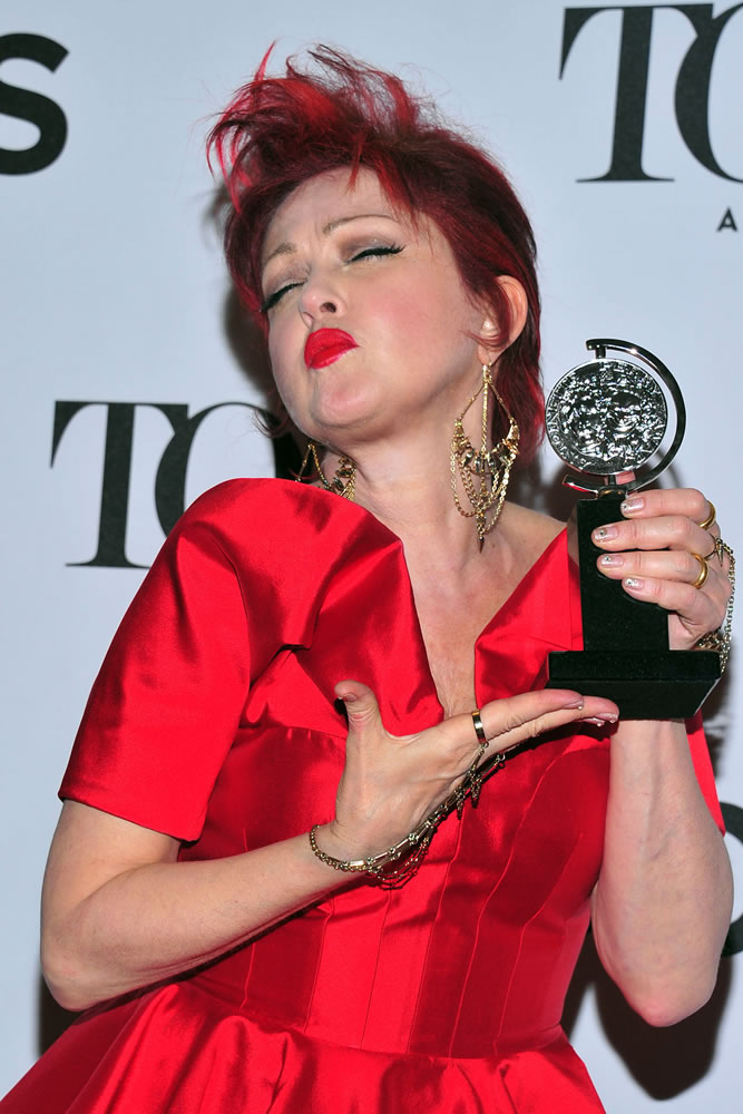 Cyndi Lauper poses with her award for best musical score for &quot;Kinky Boots.&quot;