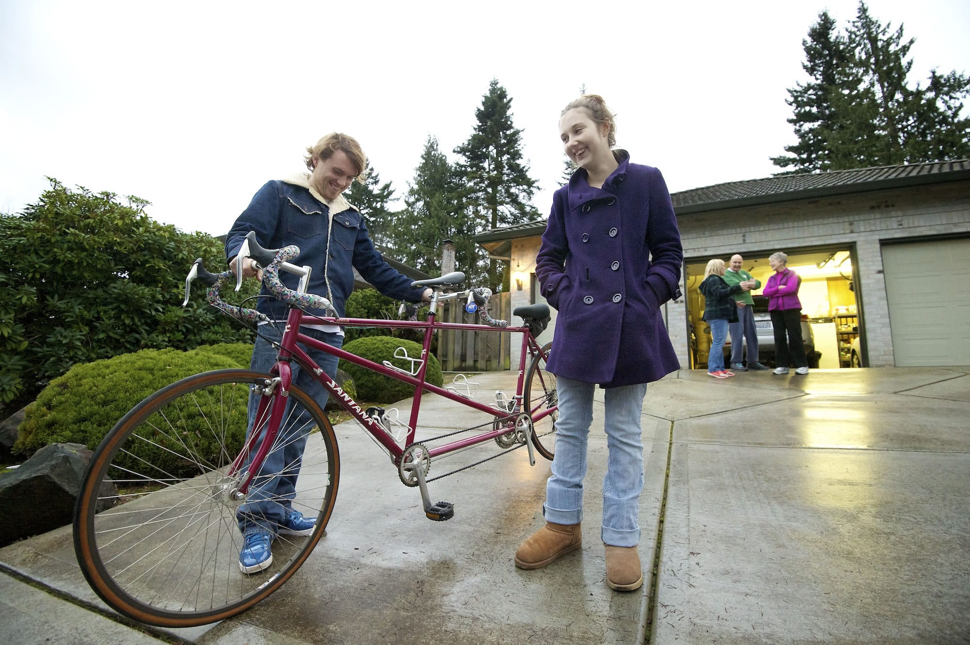 Harly and Courtney Forbes smile as they admire their new tandem bicycle given to them by Jackie and Richard Riordan on Tuesday in Vancouver. The Riordan's gave the bike to Harly and Courtney after their tandem bike was stolen the day before.