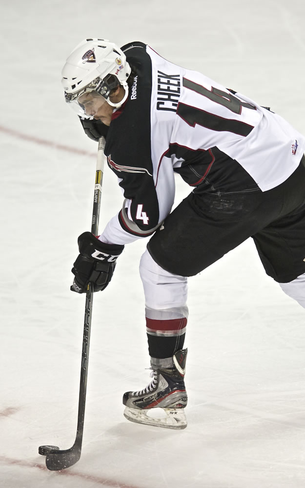 Vancouver Giants' Trevor Cheek turns up ice with the puck against the Portland on Wednesday.