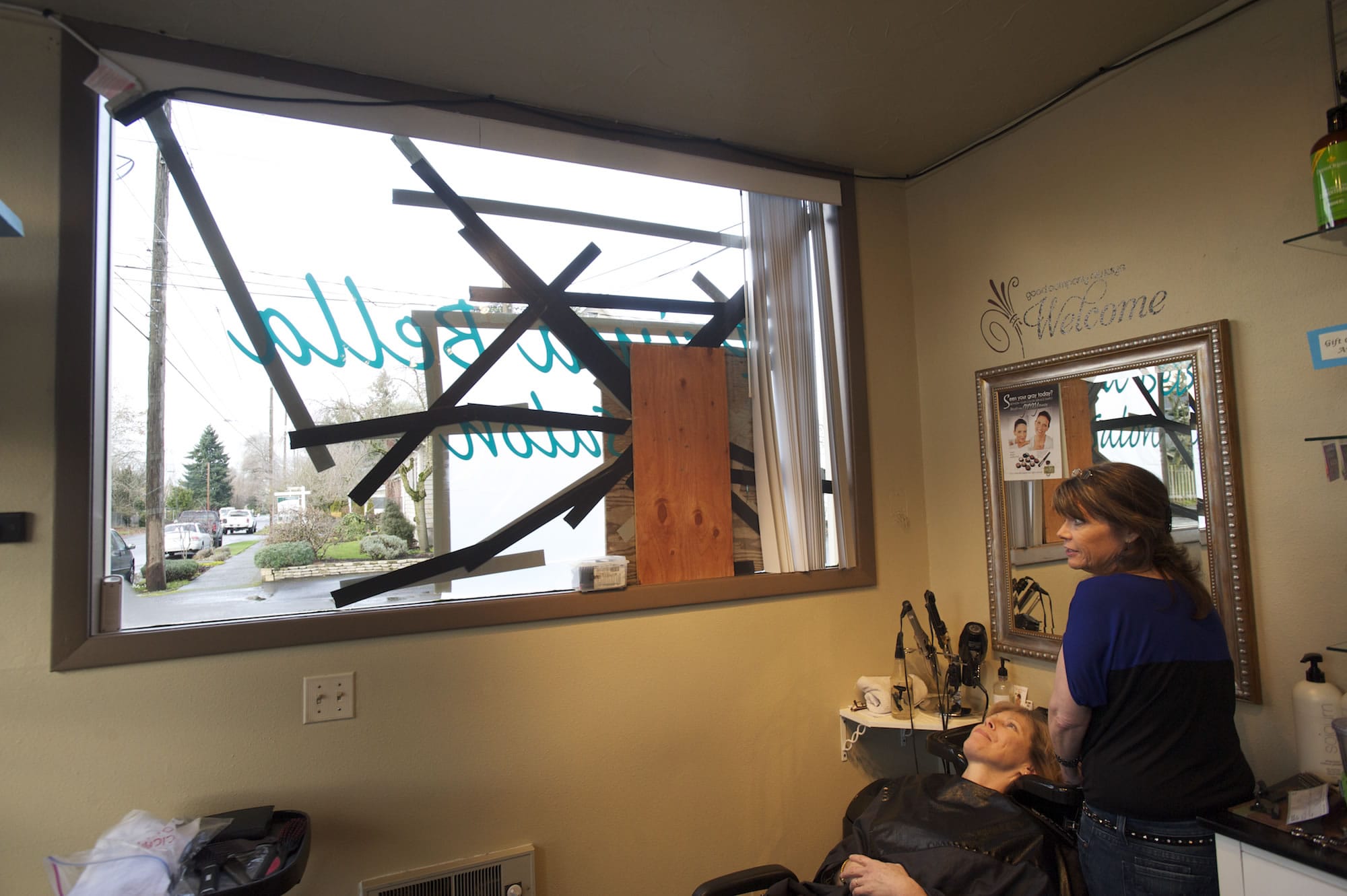 Prima Bella Salon was one of several properties vandalized along 39th Street in Vancouver's Lincoln neighborhood in December. Hairdresser Debi Clark washes client Patti Finnell's hair while she talks about finding glass all over the salon floor the morning the business was vandalized.