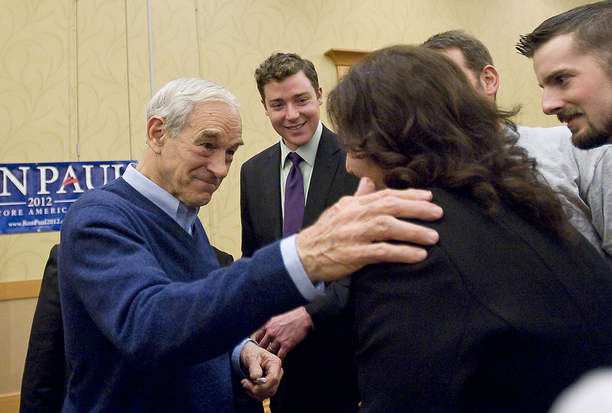 Republican presidential candidate Ron Paul meets supporters after speaking during a rally at the Hilton Vancouver Washington.