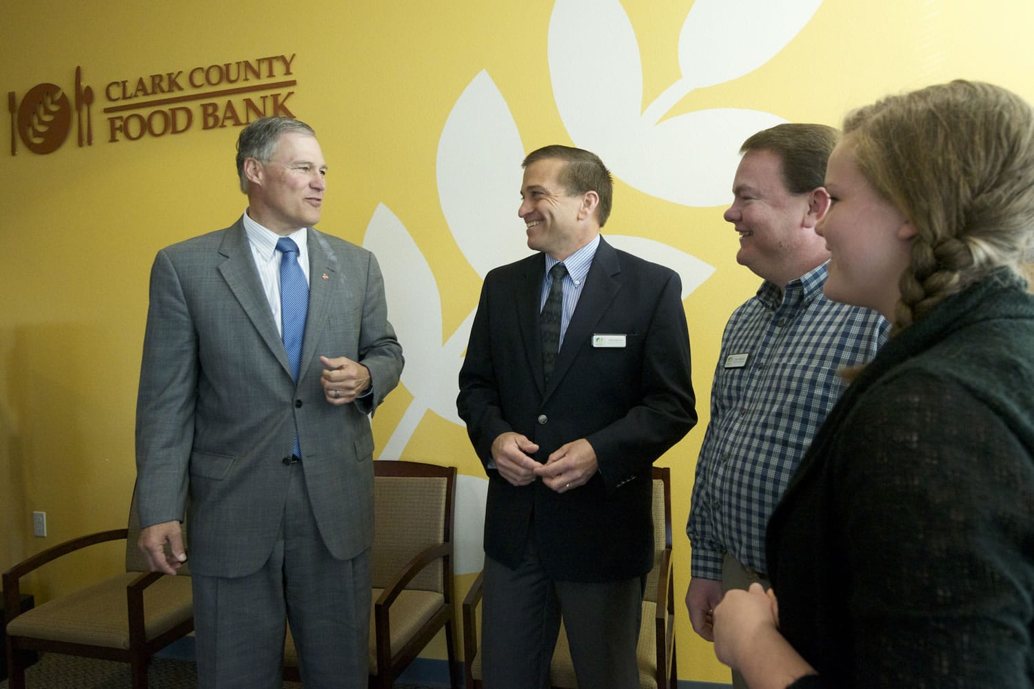 Gov. Jay Inslee visits the Clark County Food Bank on Monday in Vancouver for an informal breakfast meeting with numerous local nonprofit groups.