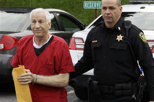Former Penn State University assistant football coach Jerry Sandusky, left, arrives for sentencing on child sex abuse charges at the Centre County Courthouse in Bellefonte, Pa., Tuesday, Oct. 9, 2012. Tuesday, Oct. 9, 2012.