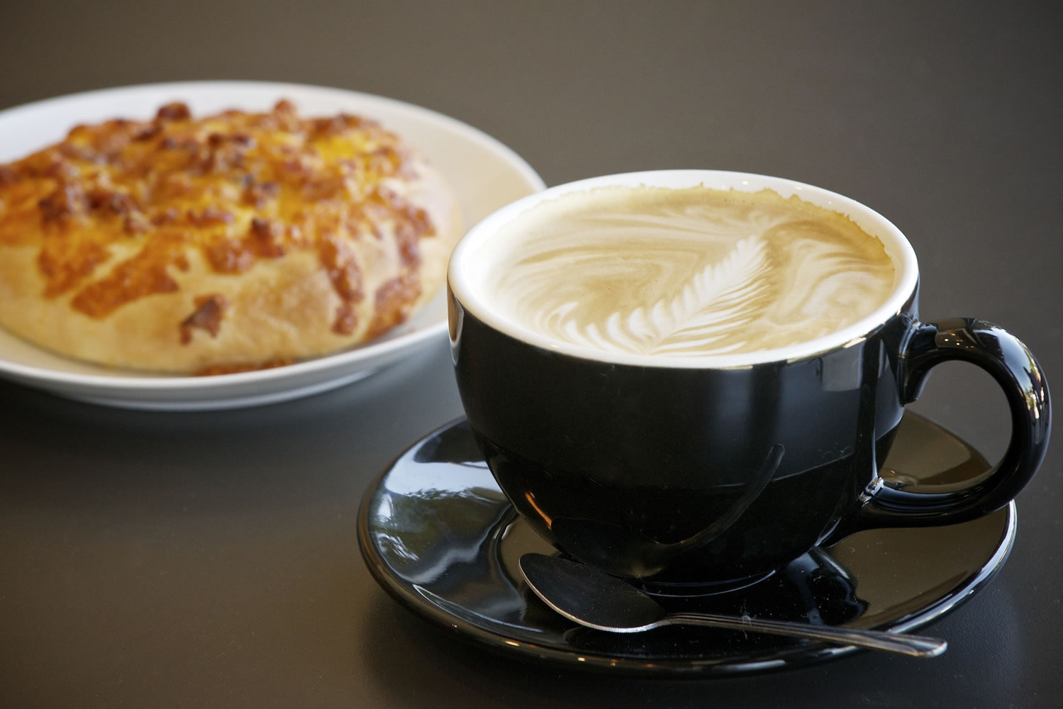 A bacon and cheese bagel and a vanilla honey latte are two of the treats available at Fairway Coffee, in the WinCo shopping center along Highway 503.