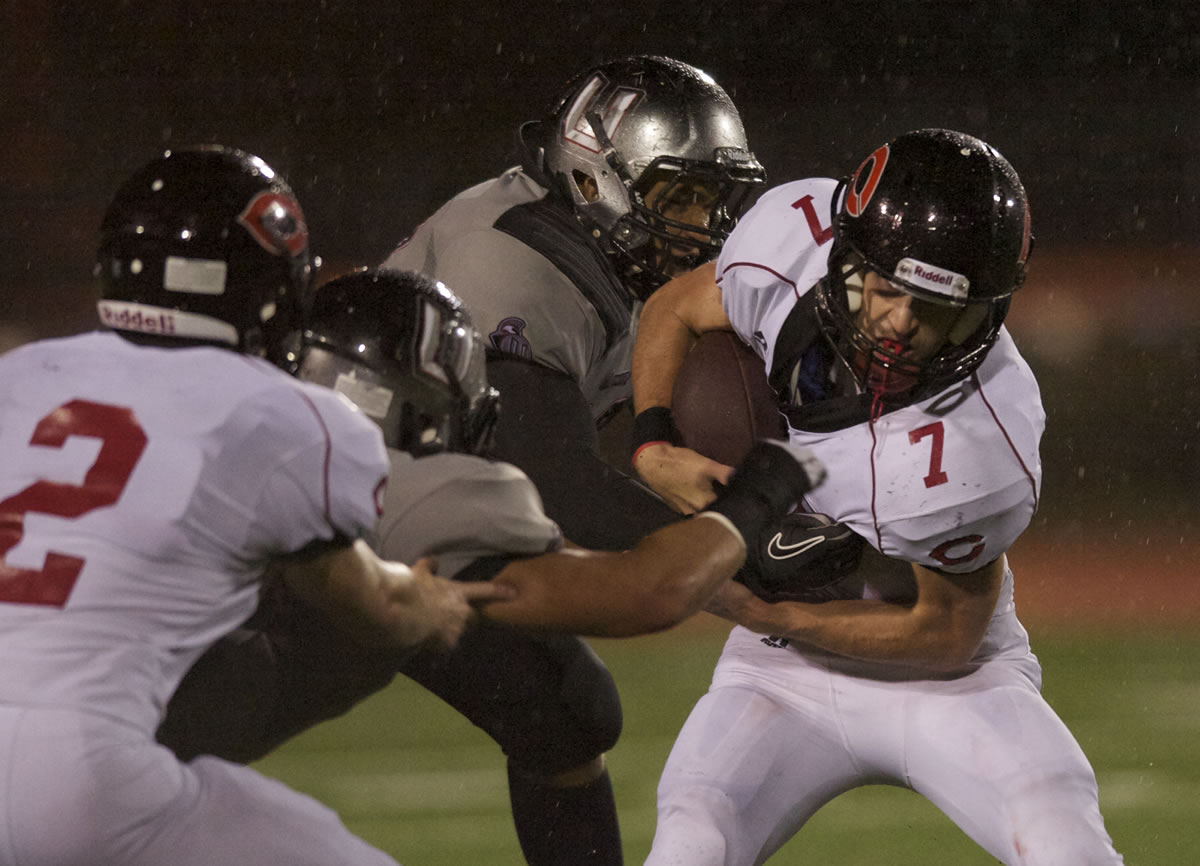 Camas' Nate Beasley, #7,  carries the ball against Union at McKenzie Stadium, Friday.